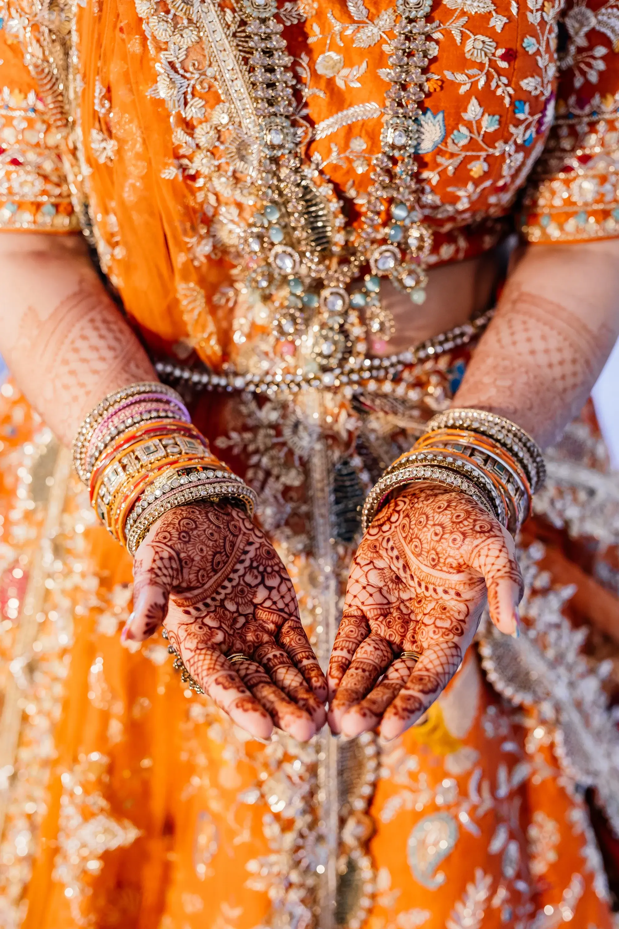 Intricate henna mehndi design on bride's hands